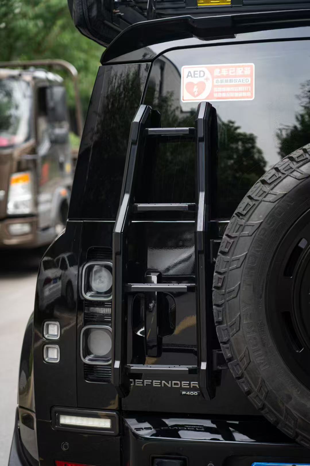 Defender climbing ladder